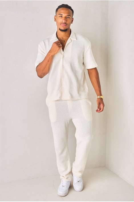 Pantalon coupe droite blanc en tissu texturé et ajouré